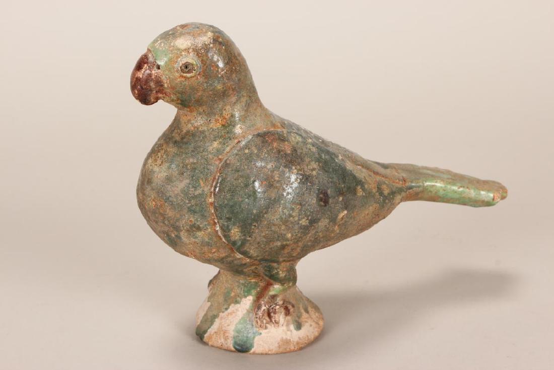 Chinese Pottery Glazed Parrot,: probably Han Dynasty, depicted with rounded beak, standing with wings by side, in green glaze, a/f, l 18cm Acquired Chiang Mai 1980's, Then Private Collection Exeter, Southern Highlands