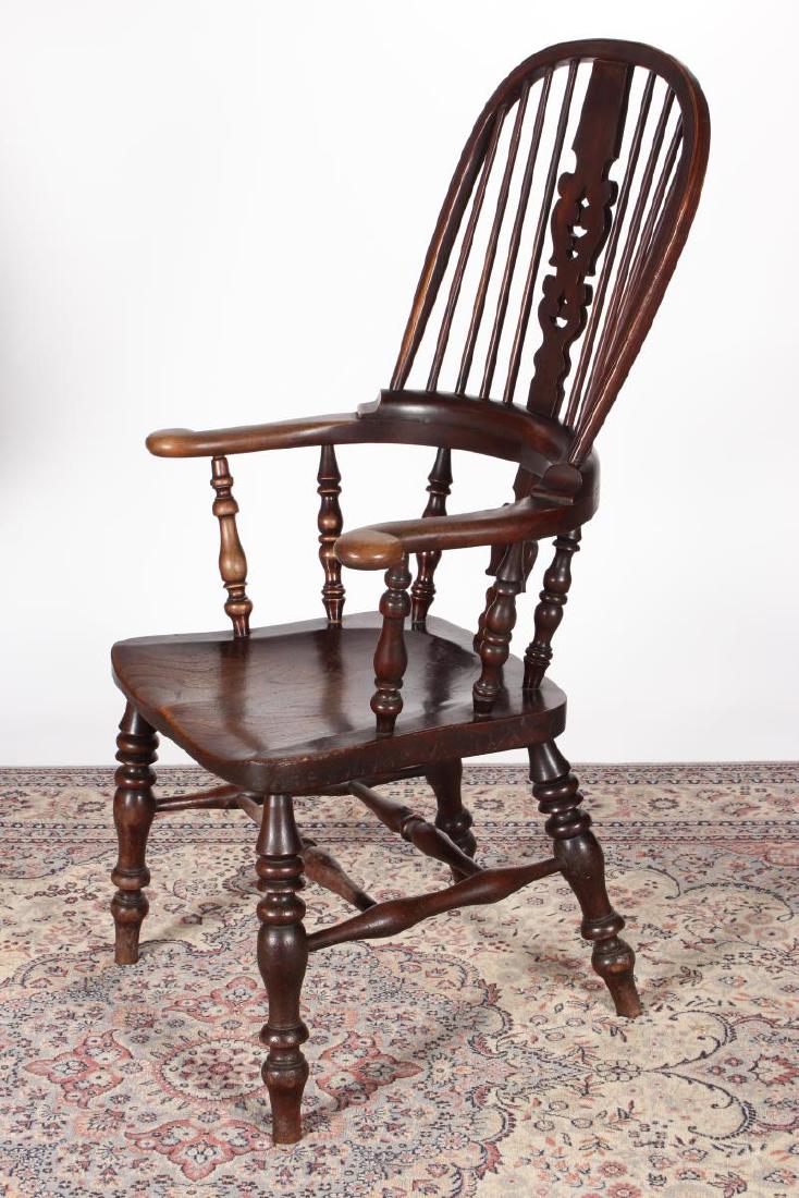 English 19th Century Windsor Chair,: in yew wood, with curved crest rail and centre splat flanked by spindles and solid arms, shaped seat, on four turned legs united by stretchers