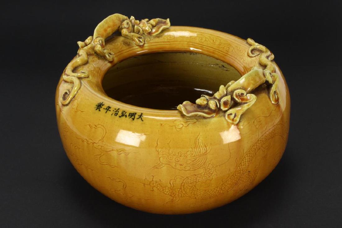 Chinese Yellow Glaze Porcelain Jardinière,: of spherical form, lightly incised with phoenix and dragon to body, with applied quilong to rim, six character mark to rim, h 14cm and l 23cm