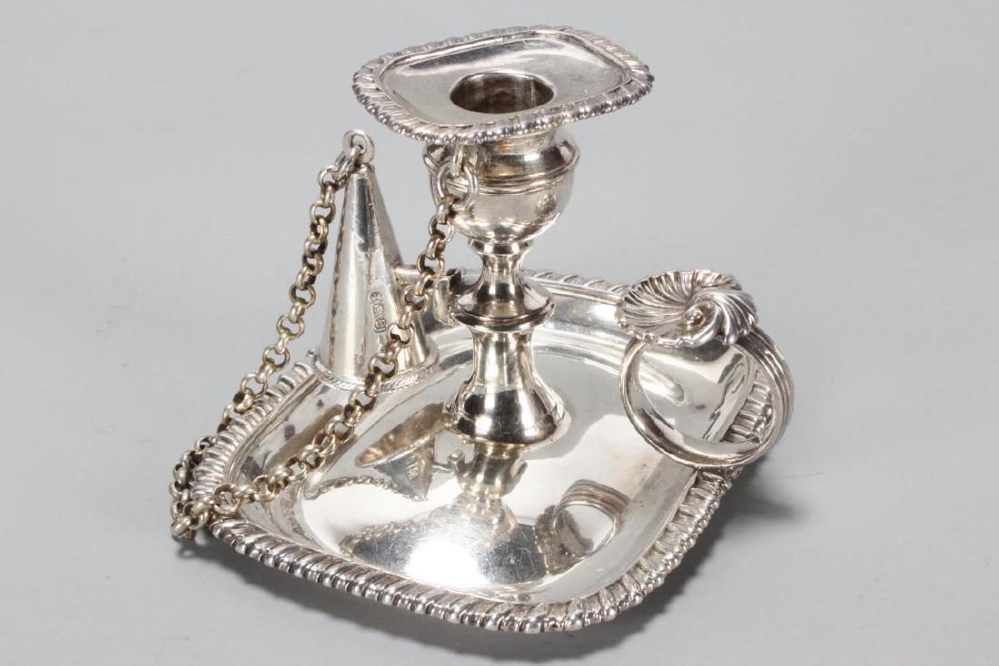 Delightful George IV Sterling Silver Chamber Stick: Sconce and Snuffer, hallmarked, London, 1820, Rebecca Emes and Edward Barnard I, with fine gadrooned border and shell thumb piece, total weight 136gm Purchased: J.H Bourdin-Smith, 1985