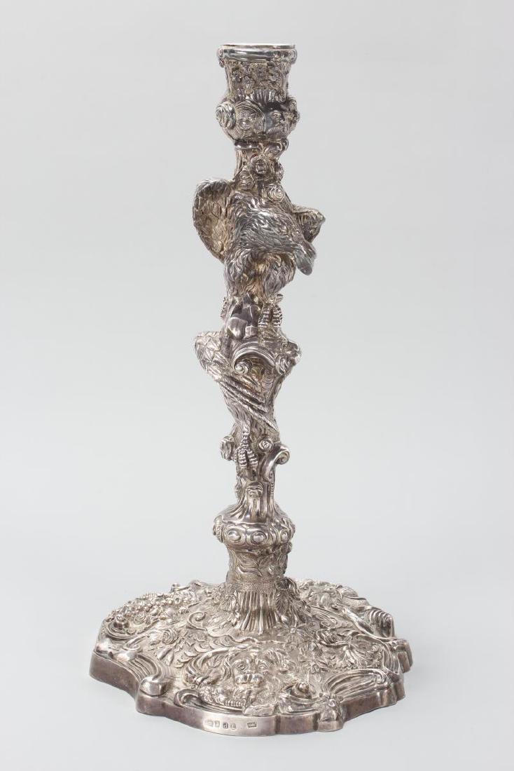 Heavy Cast George III Sterling Silver Candlestick,: hallmarked, London, 1819, B.M?, beautifully case with two eagles perched upon a column, accented with flowers, lion heads and fruit, on a shaped foot, total weight 3136gm, h 37cm