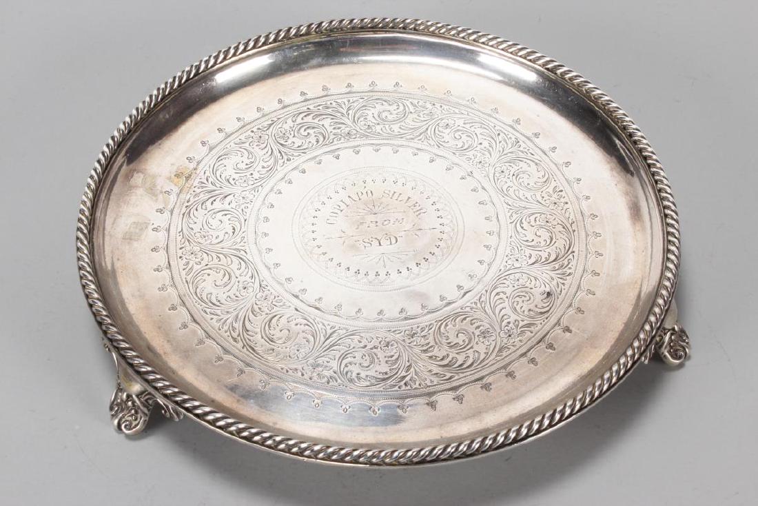 Victorian Sterling Silver Footed Salver,: hallmarked, Birmingham, 1888, F.E (Frederick Elkington), of circular form, with a roped border incised "Copiao Silver from Syd" raised on scrolled feet, total weight 380gm, d 20cm