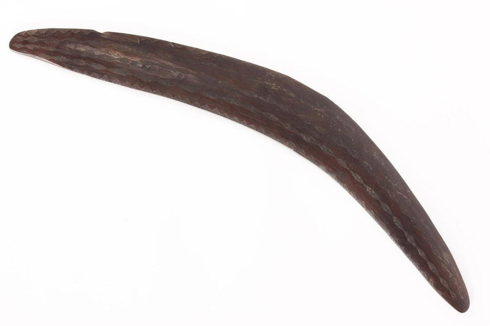 19th Century Australian Aboriginal Boomerang,: Western Queensland, finely incised line decoration, on stand, l 60cm (boomerang) Provenance: Purchased Arthur Whall, 18th Oct 2016, then Private Collection, Sydney