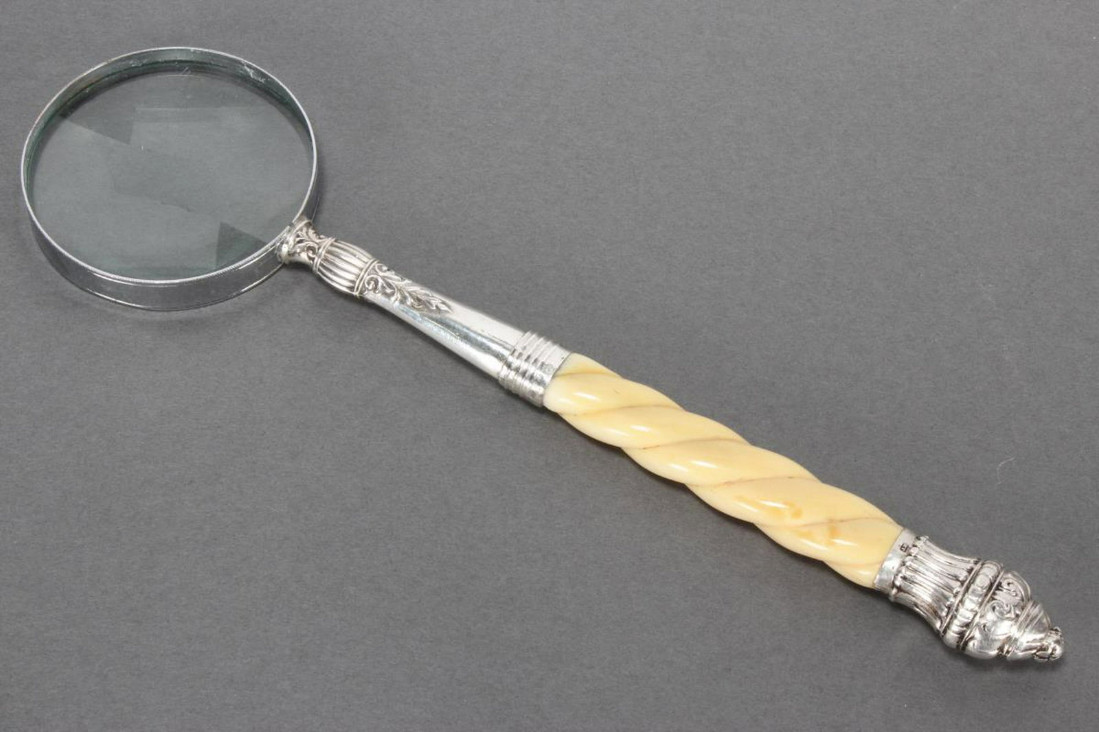 Sterling Silver and Whale Bone Carved Magnifying: Glass, with carved spiral handle and silver mounts, l 30cm