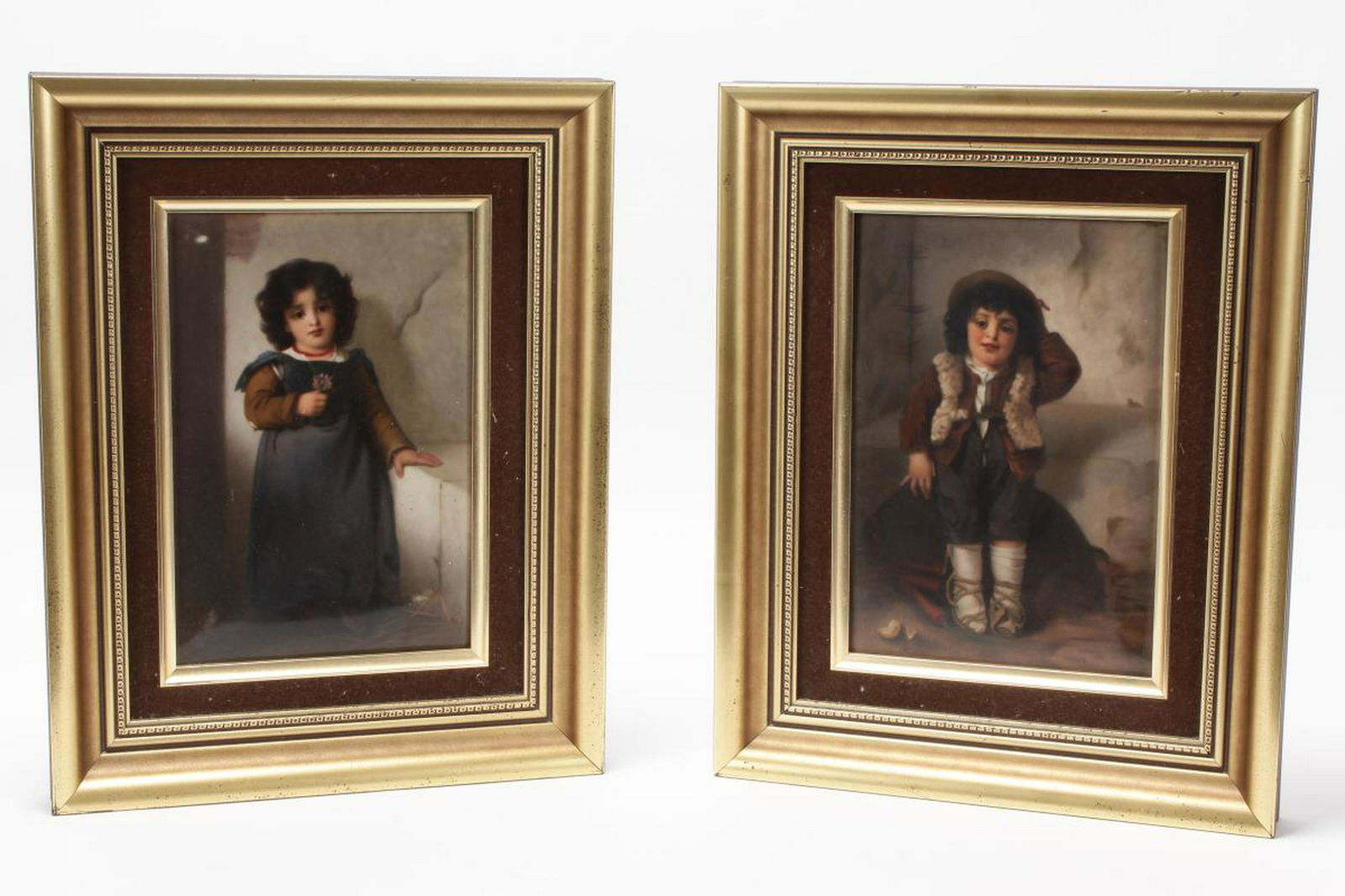 Fine Pair of KPM Painted Porcelain Plaques,: of rectangular form, one painted with an image of a small boy seated on a basket with carrots and onion at his feet, the other depicting a young gilt holding a single flower, in soft tones of brown an