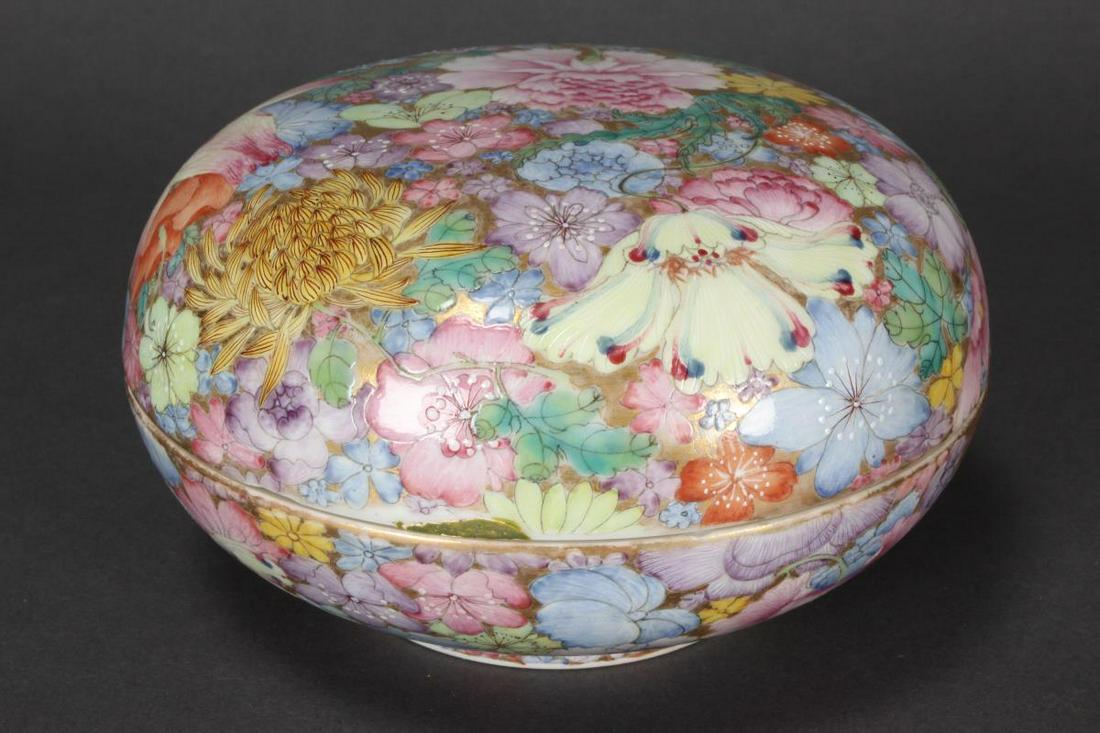 Chinese Thousand Flowers Porcelain Box and Cover,: of bun form, decorated continuously with peony, chrysanthemum and lotus, in tones of pink, green, blue and purple on a gilt ground, mark to base, a/f, h 8cm and d 14.5cm