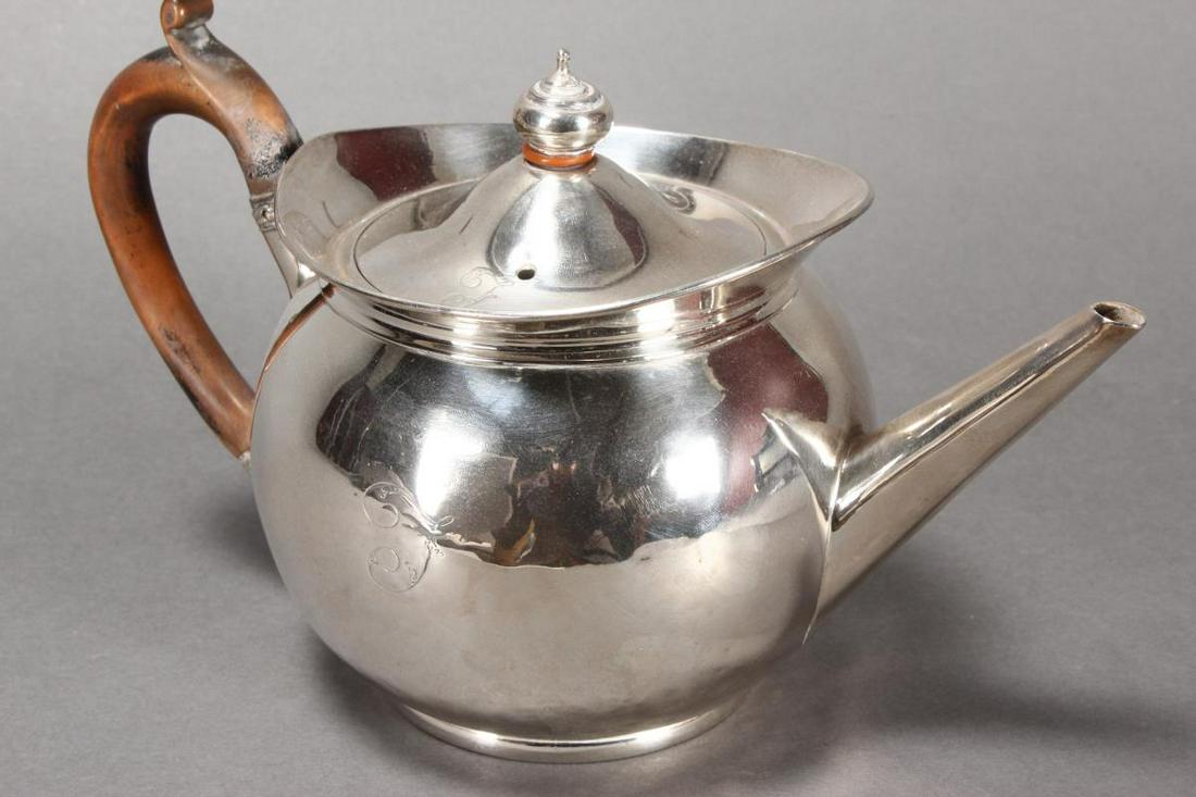 Wonderful George III Sterling Silver Teapot,: hallmarked London, 1799, J.E (John Emes), of plain globular form below a flared collar, with straight spout and turned handle, total weight 758gm, h 16cm