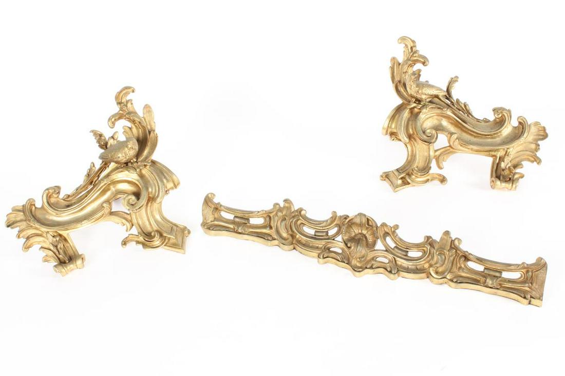 Wonderful Pair of French Ormolu Chentes and: Guard, in Louis XV taste, in the form of scrolling acanthus and s-scrolls, accented with two parrots perched to the fire dogs (3)