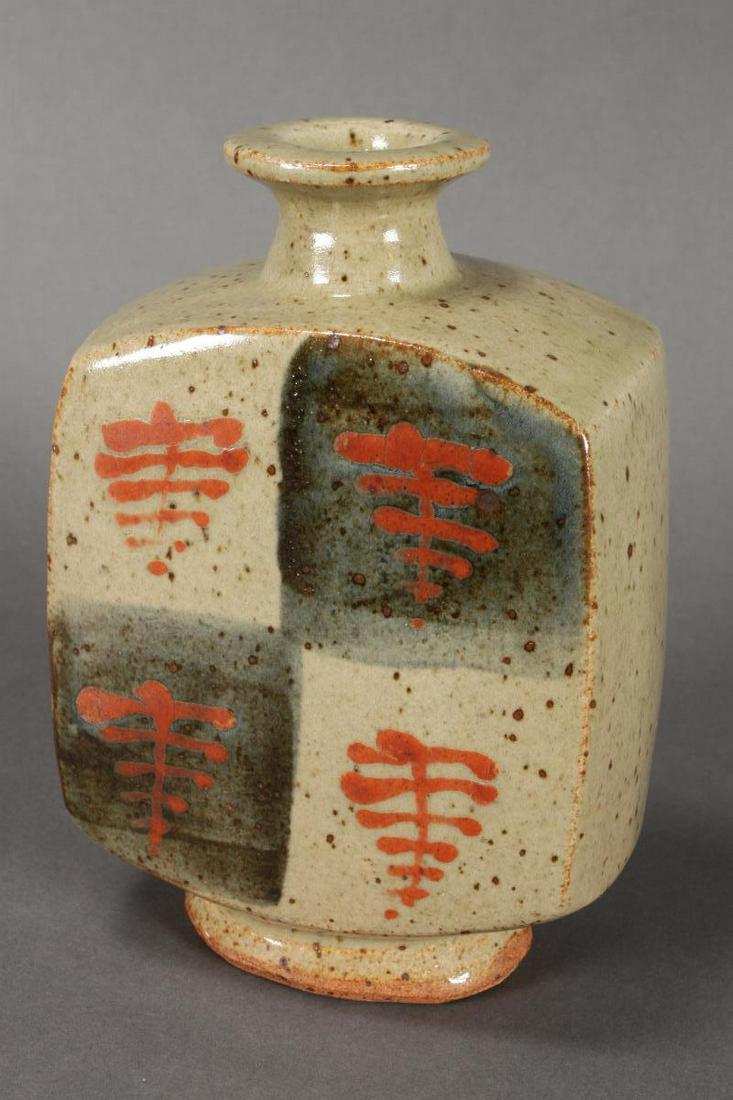 Bernard Leach (British 1887-1979) Stoneware Bottle: Vase, of rectangular form, with a flattened rim and resting on an oval foot, in Tomato Red Tree pattern, two impressed studio marks to base for Bernard Leach and St. Ives, h 21cm Note: Similar feature