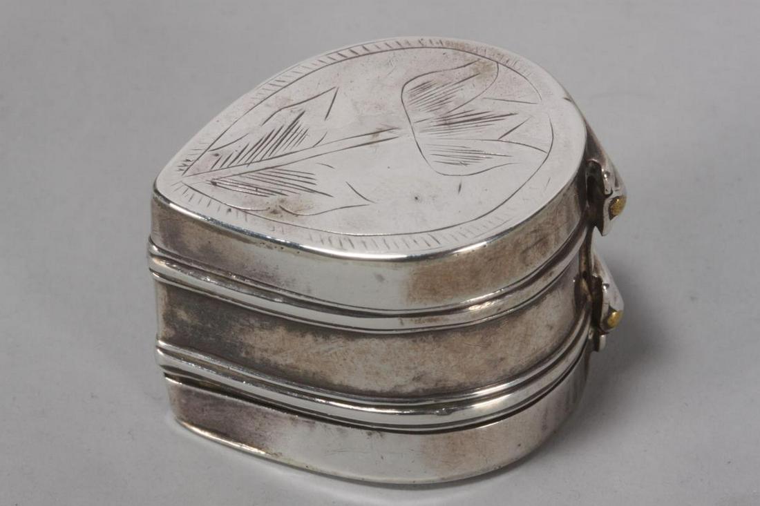 William III Sterling Silver Nutmeg Grater,: marked T.K (Thomas Kedden), c.1695, of teardrop form, with hinged cover engraved with tulip, opening to reveal steel grater, with hinged base engraved with flower, total weight 23gm, h 2.5cm and w 3.5