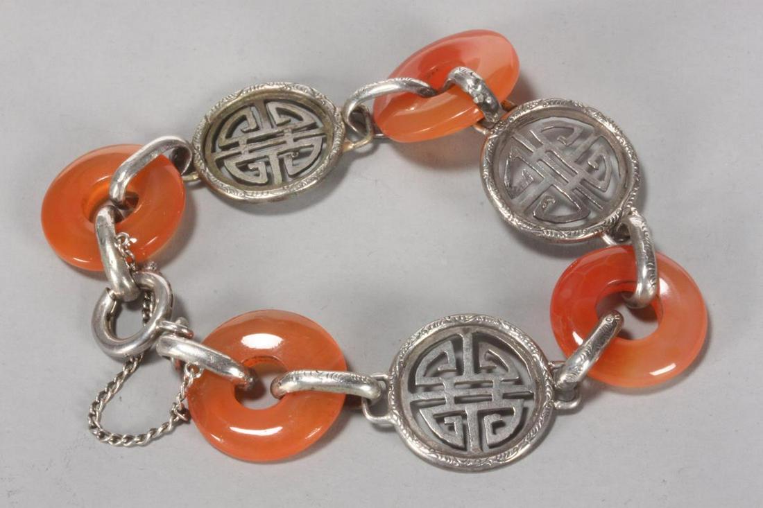 Chinese Silver and Carnelian Bracelet,: c.1950's, with carnelian discs alternating with Chinese symbols of longevity