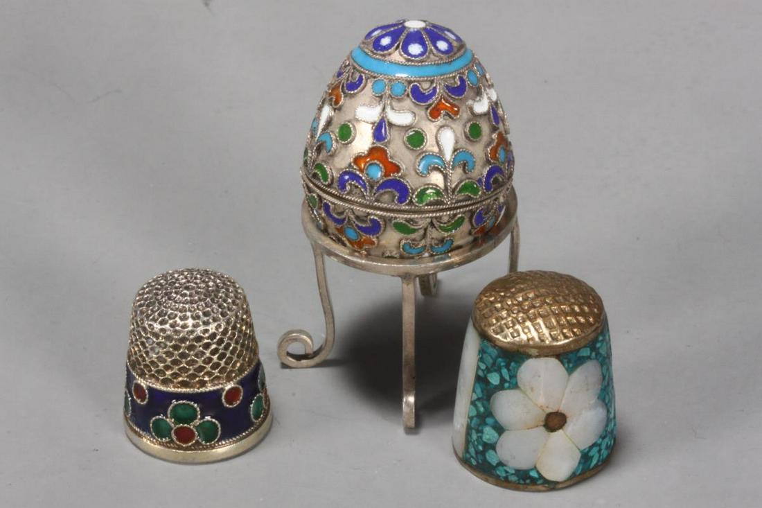 Russian Miniature Silver and Miniature Egg on: Stand, together with two thimbles, (3)