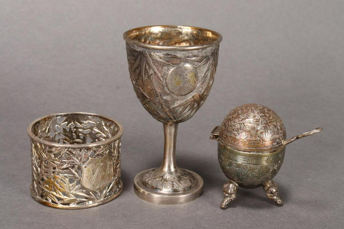 Three Chinese Silver Objects,: including a egg cup by Tuckshang, a napkin ring by Woshing and a salt, (3)