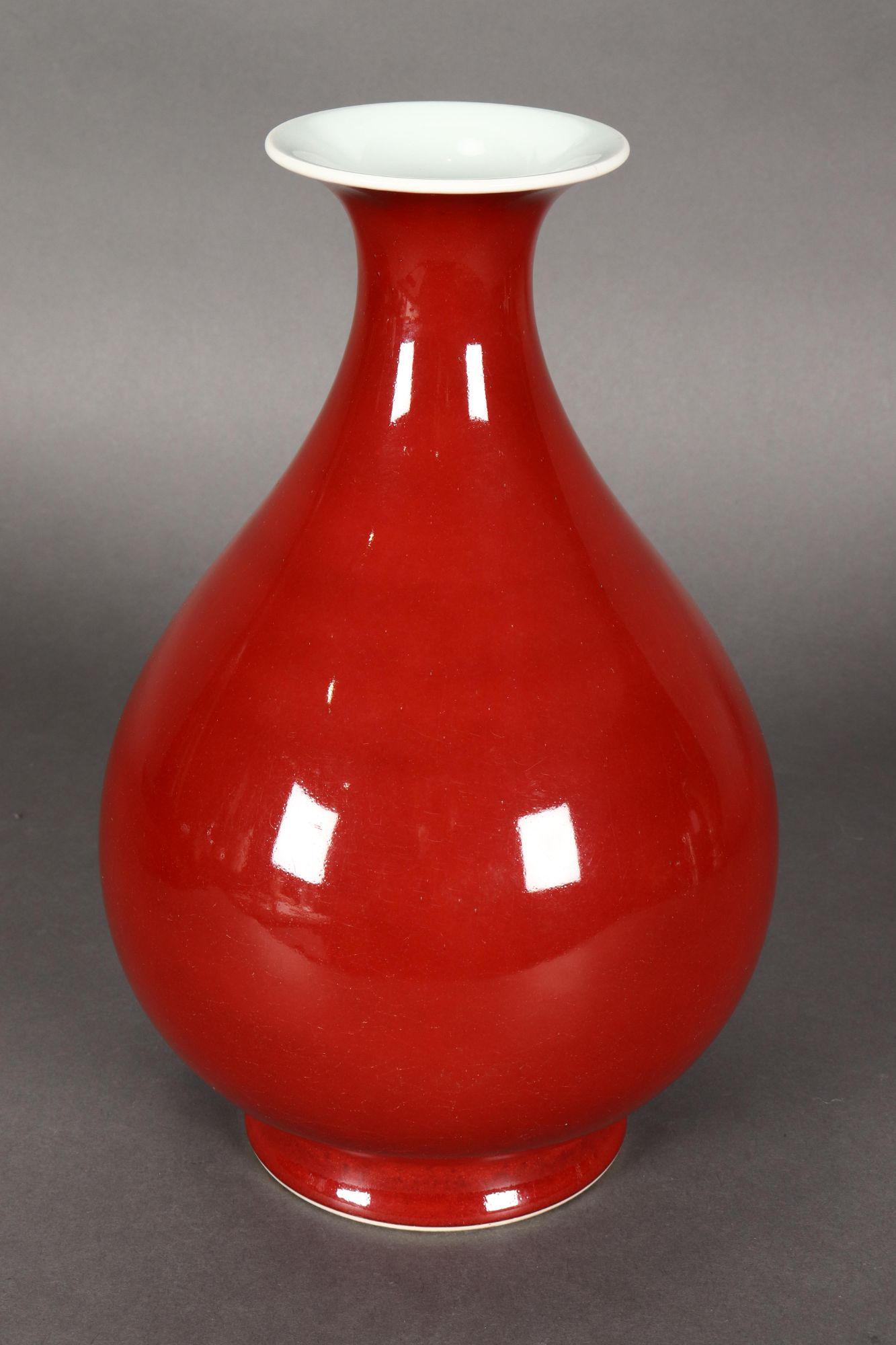 Superb Chinese Sang de Boeuf Porcelain Vase,: with a spreading lip above a baluster body, on a circular foot, marked with Qianlong seal mark to base, h 30cm