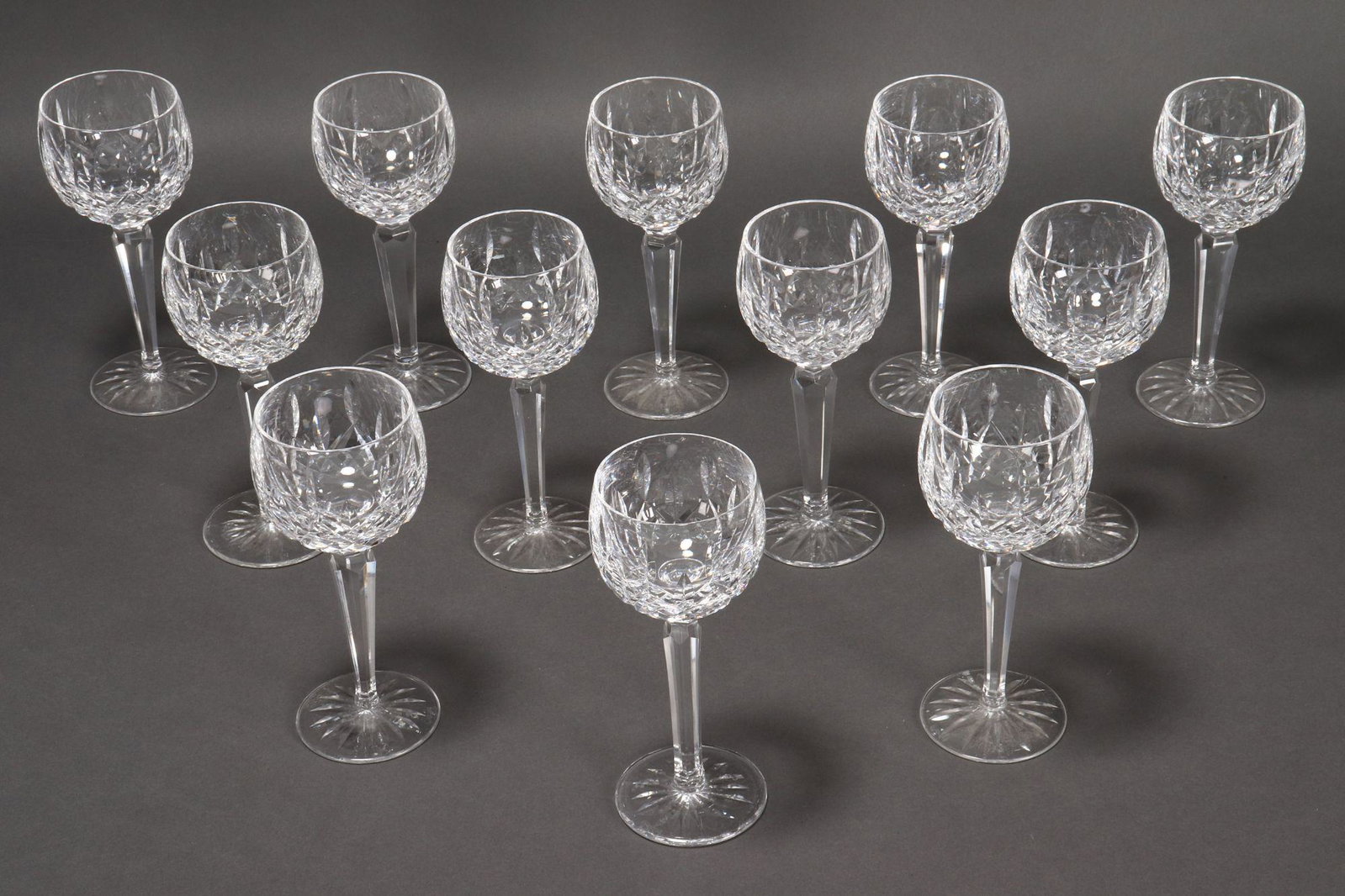 Magnificent Set of Twelve Waterford Crystal Wine: Glasses, with facetted stems, h 18.5cm (12)