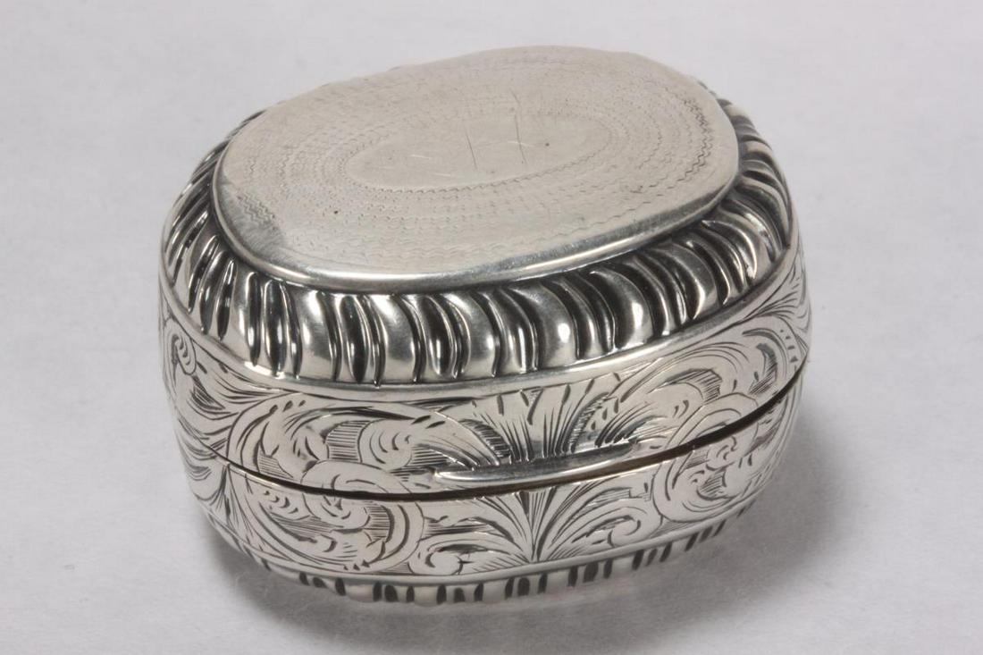 Victorian Sterling Silver Nutmeg Grater,: hallmarked Birmingham, 1856, H&T (Hilliard and Thomason), of oval form, the body with all over foliate scroll decoration and gadrooning, the hinged cover opening to reveal a steel hinged grater, heigh