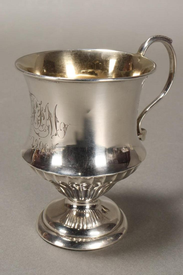 Edwardian Sterling Silver Christening Cup,: hallmarked, Sheffield, 1905, JD//WD, of thistle form, with lower fluted body and s-scroll handle, on a stepped circular foot, with gilt interior, total weight 55gm, height 9cm
