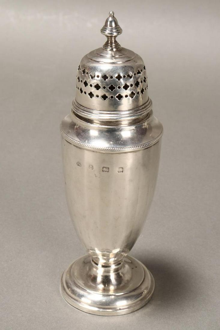 George V Sterling Silver Sugar Caster,: hallmarked, Birmingham, 1925, Aide Bros, with acorn shaped finial above a cover pierced in repeating quatre foil motifs, above tapering body with slight facetted form, on circular foot, total weight 4