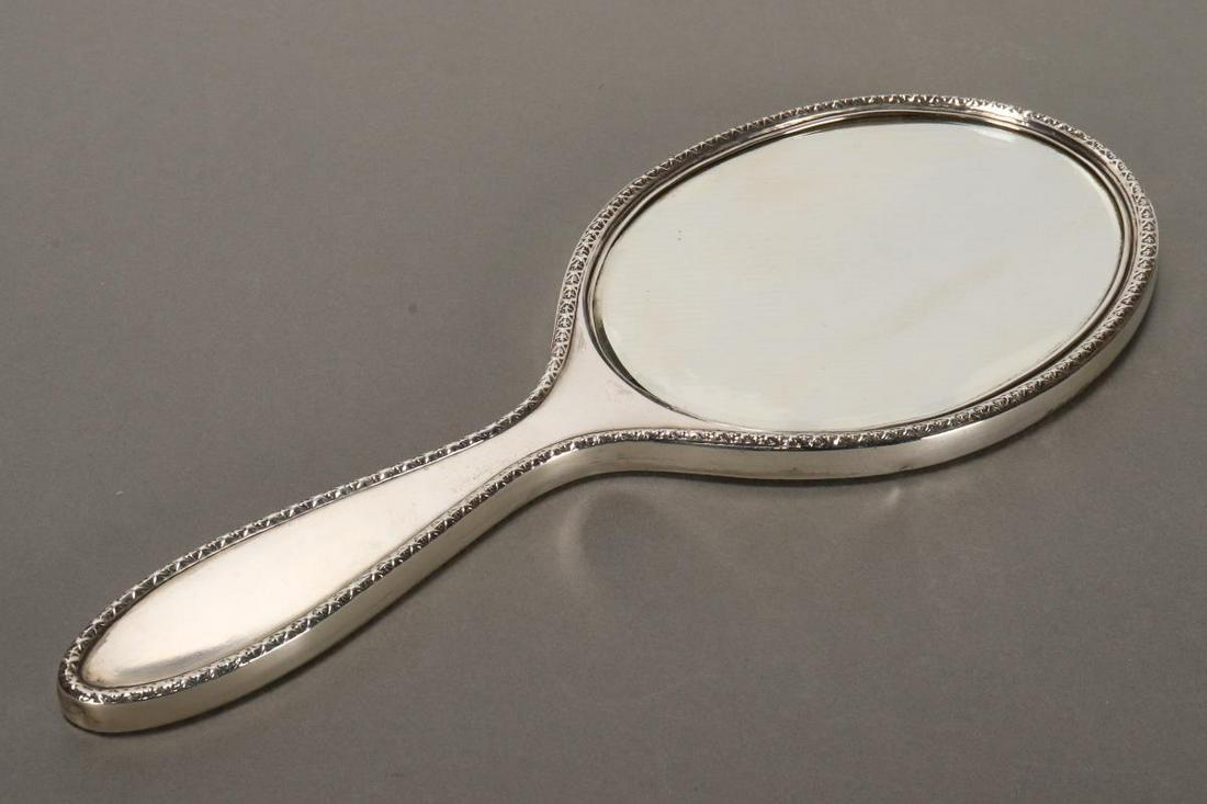 George V Sterling Silver Hand Mirror,: hallmarked, Birmingham, 1911, S star B, of oval form, with engine turned decoration, inscribed 'From the Directors// David Jones// Aug 24 1912,' length 29.5cm