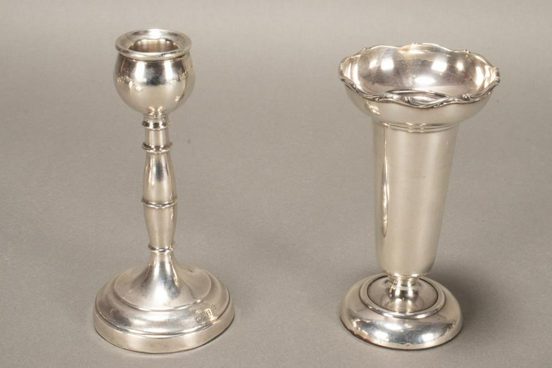 George V Sterling Silver Candlestick,: hallmarked, London, Sheffield, E.B.S, together with and Edwardian silver candlestick, 1907, Hardy Bros, both weighted, height 13cm and 12cm (2)