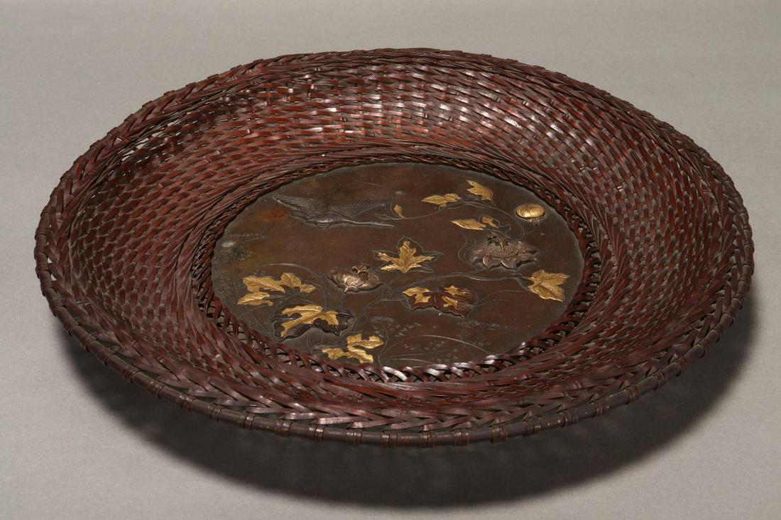 Japanese Meiji Period Mixed Metal Weave Dish,: (1868-1912), of shallow circular form, with central bronze roundel depicting blossoming flowers and goose with gold accenting, with basket weave surround, height 4cm and diameter 28cm