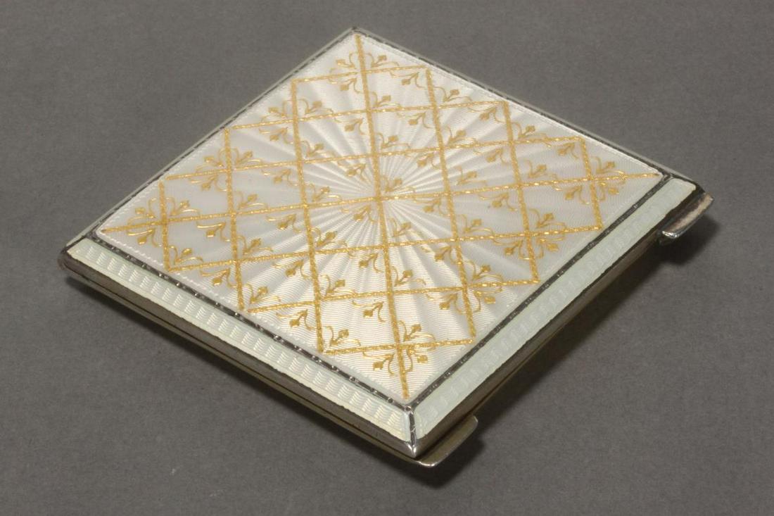 George V Sterling Silver and Enamel Compact,: hallmarked Birmingham, 1924, Hardy Bros, of square form, with enamel fleur patterning to cover, in tones of cream and gilt, total weight 78gm, 7cm x 7cm