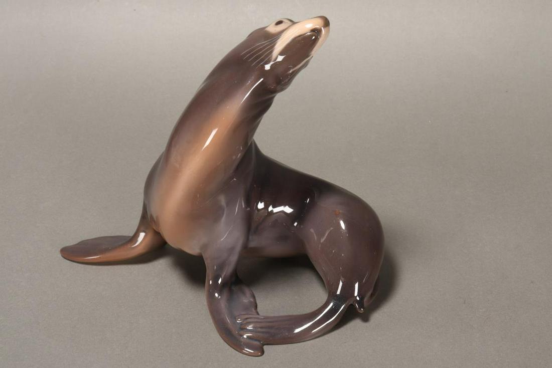 Bing and Grondahl Porcelain Figure of a Seal,: depicted turning its body backwards, in natural tones, length 17cm