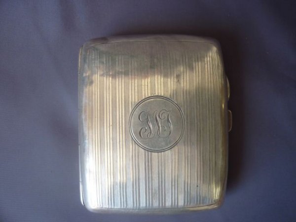 Edwardian Sterling Silver Cigarette Case,: hallmarked, Birmingham, 1916, of pillow form, with engine turning to the top