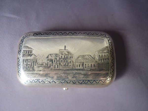 19th Century Russian Silver Niello Cigar Case,: Moscow, c.1885, of pillow form, engraved with a townscape to the front, and lattice motif to the back, 9.5cm x 6cm