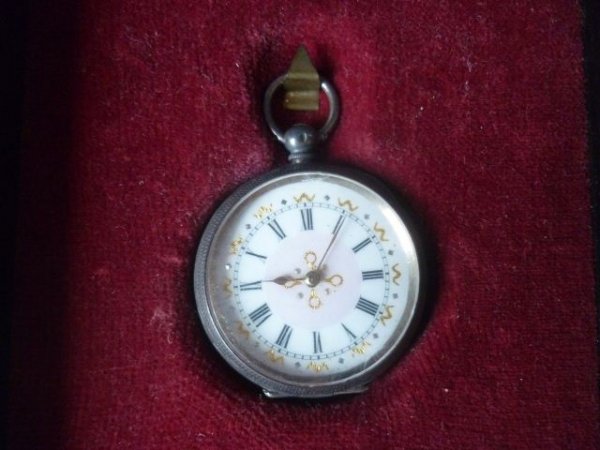 Late 19th Century French Silver Pocket Watch,: with a circular white and pink enamel dial, with roman numerals, set within hanging framed