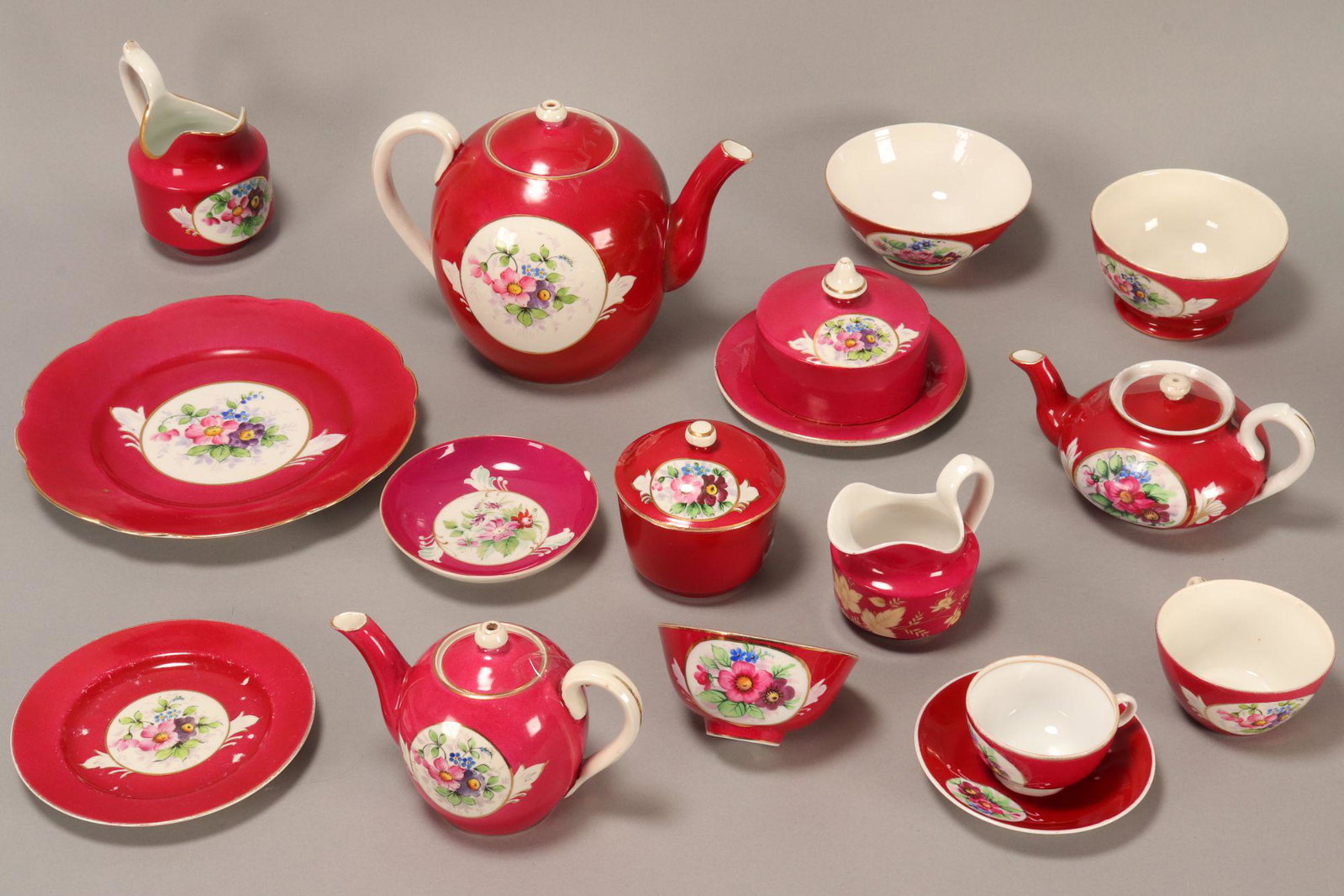 Wonderful 19th Century Russian Porcelain Tea Set,: by the Gardner factory, comprising twelve teacups and saucers, six coffee cups and saucers, six side plates, four tea/coffee pots, three creamers, three slops bowls, two covered sugar bowls, one cake 