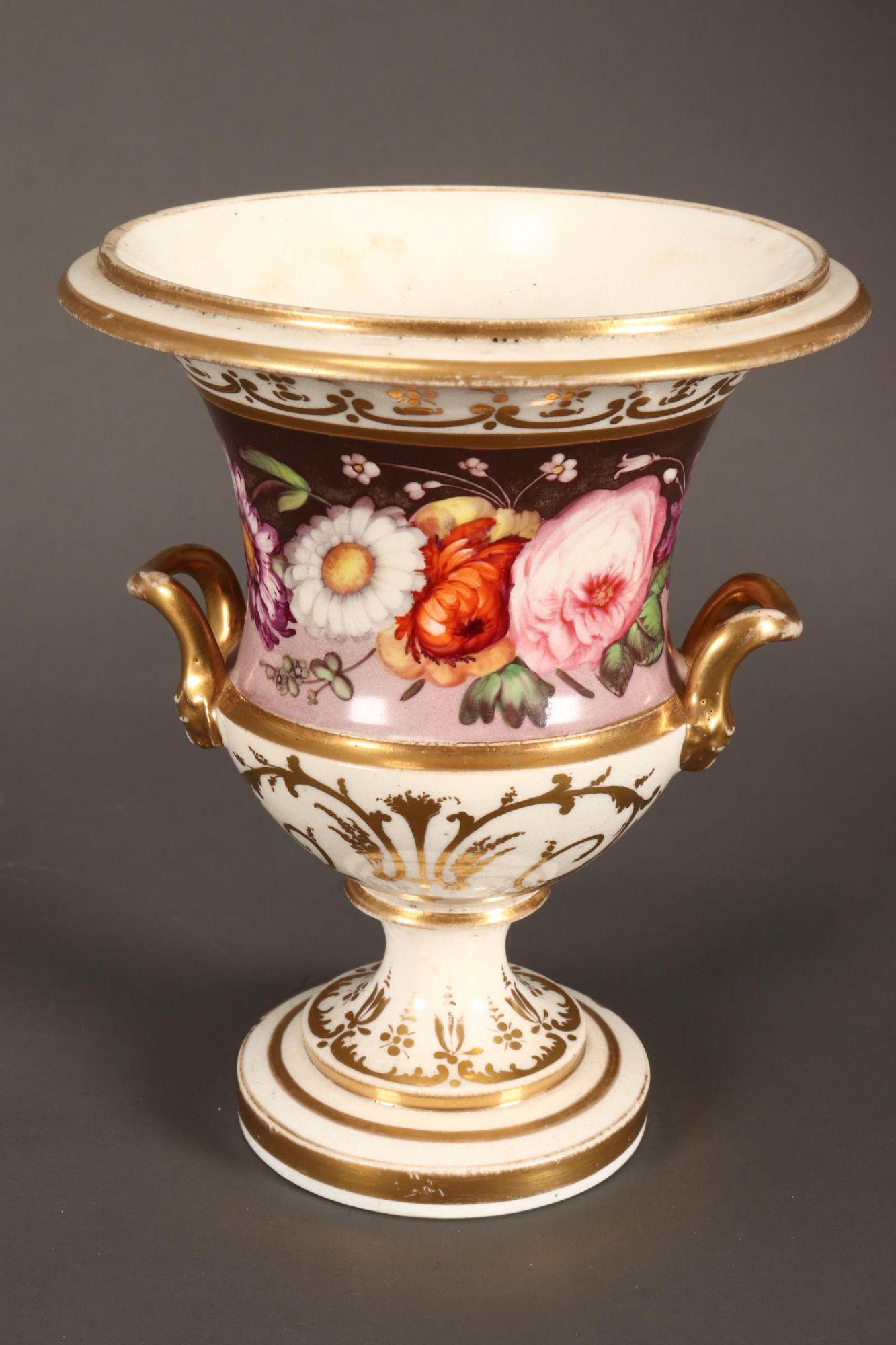 19th Century English Porcelain Urn,: with twin handles, decorated with floral frieze, accented with gilt c-scroll and acanthus motifs, with British Antique Dealers Association label to base, height 16cm