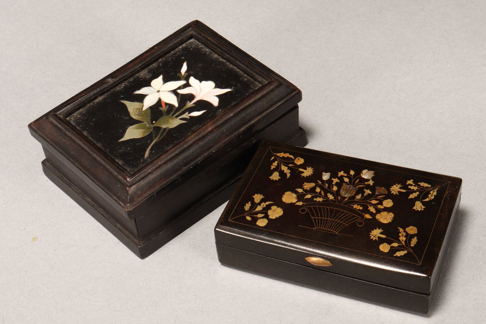 Two 19th Century Petite Boxes and Covers,: comprising tortoiseshell rectangular box with mother of pearl and gilt floral inlay, width 7cm, together with a rectangular timber box with pietra dura floral panel to cover, width 8cm (2)