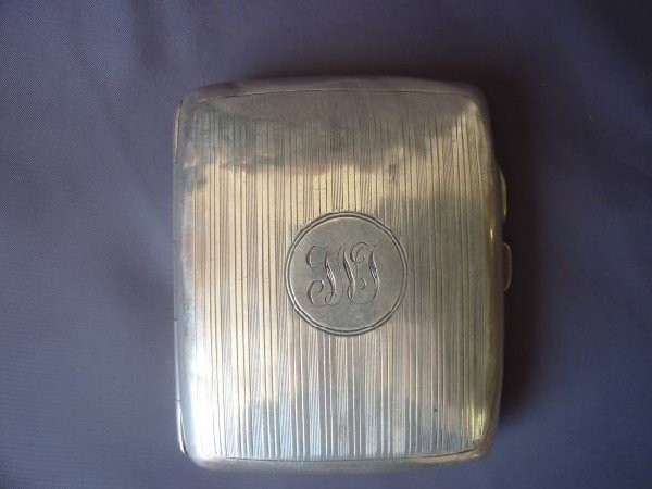 Edwardian Sterling Silver Cigarette Case,: hallmarked, Birmingham, 1916, of pillow form, with engine turning to the top