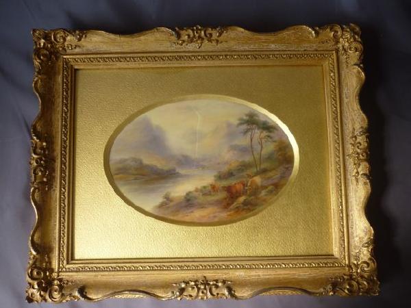 Framed Royal Worcester Painted Porcelain Plaque,: c.1928, by John Stinton, of oval form depicting "Loch Lommond" featuring highland cattle by shores of loch Lommond, with a mountain landscape in the back ground, titled verso, a/f, 22cm x 15.5cm