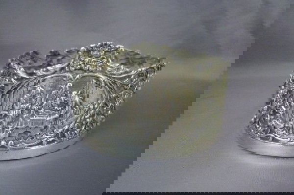 Dutch Silver Coaster,: with a central medallion depicting a tavern scene in a pierced bird and brach motif