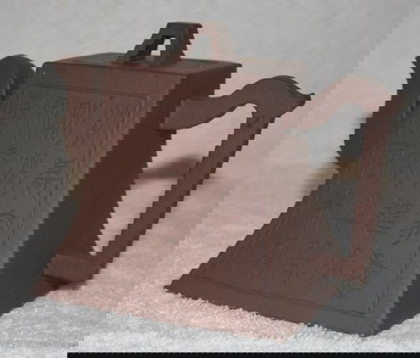 Chinese Redware Teapot,: modelled in flared form with panels of script, l 13cm