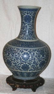 Chinese Porcelain Blue and White Floor Vase,: decorated with scrolling vines and centered with flower heads with cloud scroll highlights, h 55cm