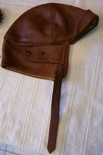 AMY JOHNSON'S AIRHELMET: A leather air-helmet, approx 22 x 25cm when flat, as used by the aviatrix Amy Johnson in 1929 and 1930, and given to George Burns, the caretaker of Mascot airport in 1930 following Johnson's record fl