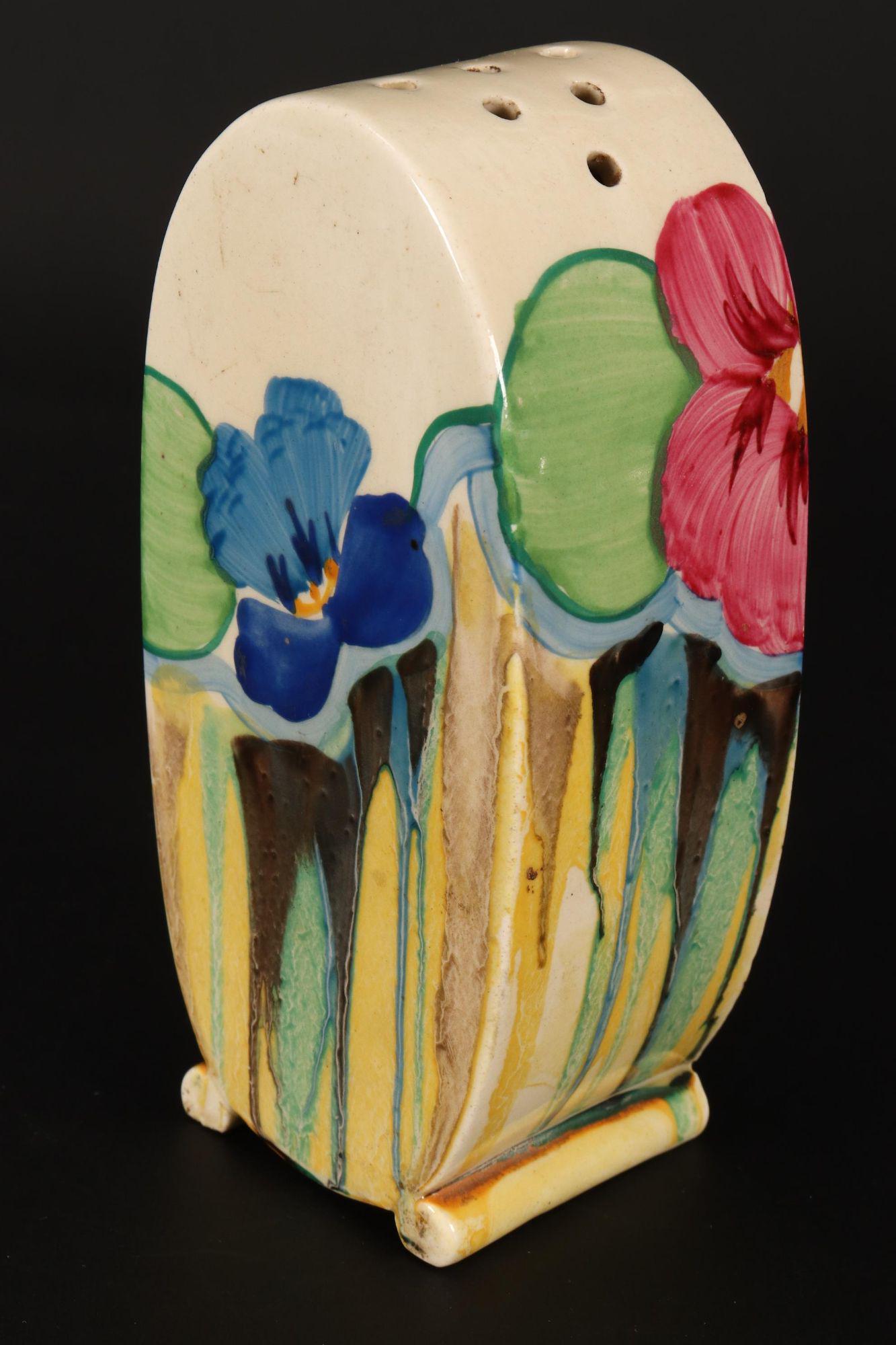 Clarice Cliff Bizarre 'Pansies' Sugar Sifter,: of bonjour shape, decorated with pansies in tones of yellow, pink, green and blue, a/f, height 12.5cm
