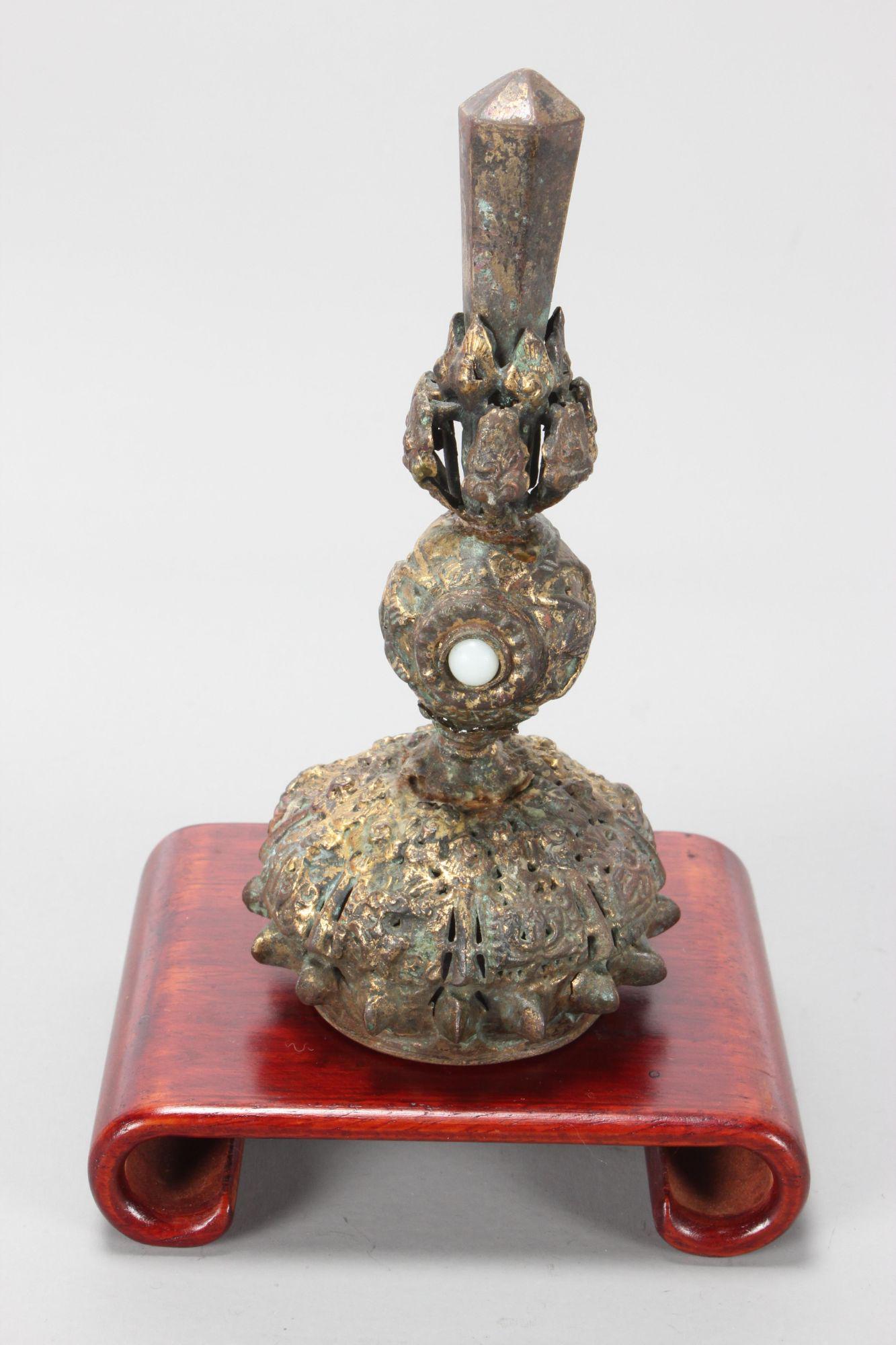 Chinese Late Qing Dynasty 7th Rank Official Hat: Spike, c.1850, obelisk finial above ball set with white stone above domed and pierced base, set on wooden stand, h 11cm Provenance: Collection of Judith Rutherford