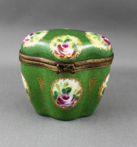 Limoge Porcelain Box and Cover,: of quarterfoil form, decorated with roses on a speckled green ground