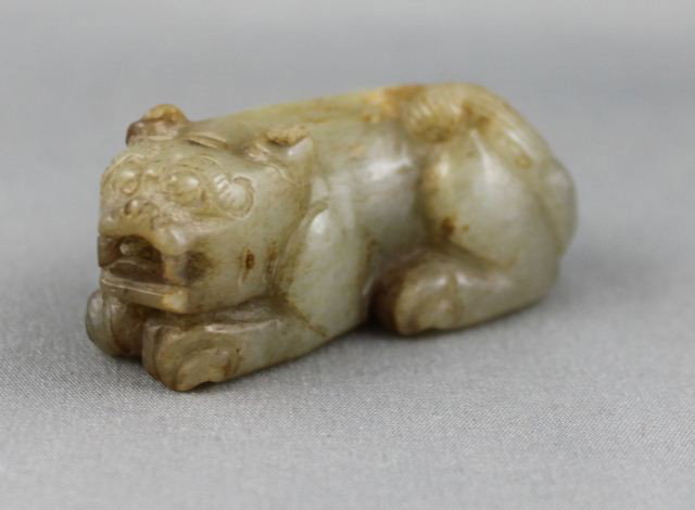 Good Chinese Qing Dynasty Jade,: Dog/Pig, in white jade with russet inclusions, in recumbent position, with paws under body, Prov: Purchased Joseph Neumann, Private Collection Sydney