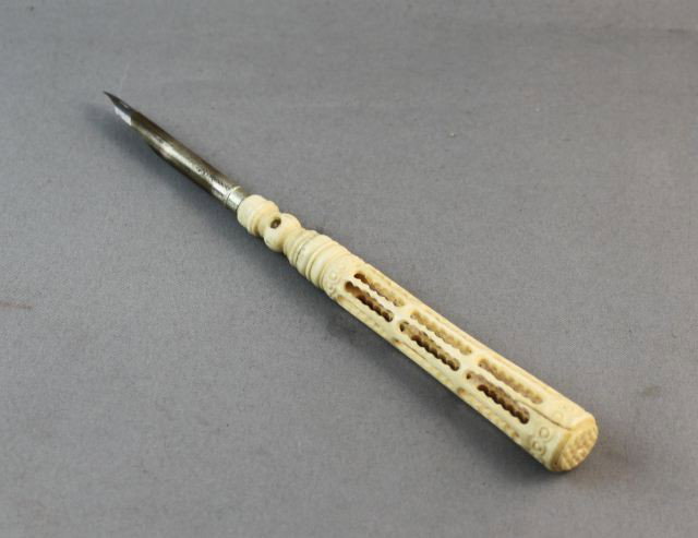 Victorian Carved Whale Bone Pen and Stanhope,: of carved an pierced tapering form, screwing to reveal dip pen, with image of Napoleons tomb, a/f, l 15.5cm