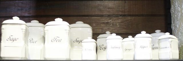 Set of Eleven Victoria China Kitchen Canisters,: c.1930, in blanc de chine of square form, set with molded columns to the edge, a/f to one lid