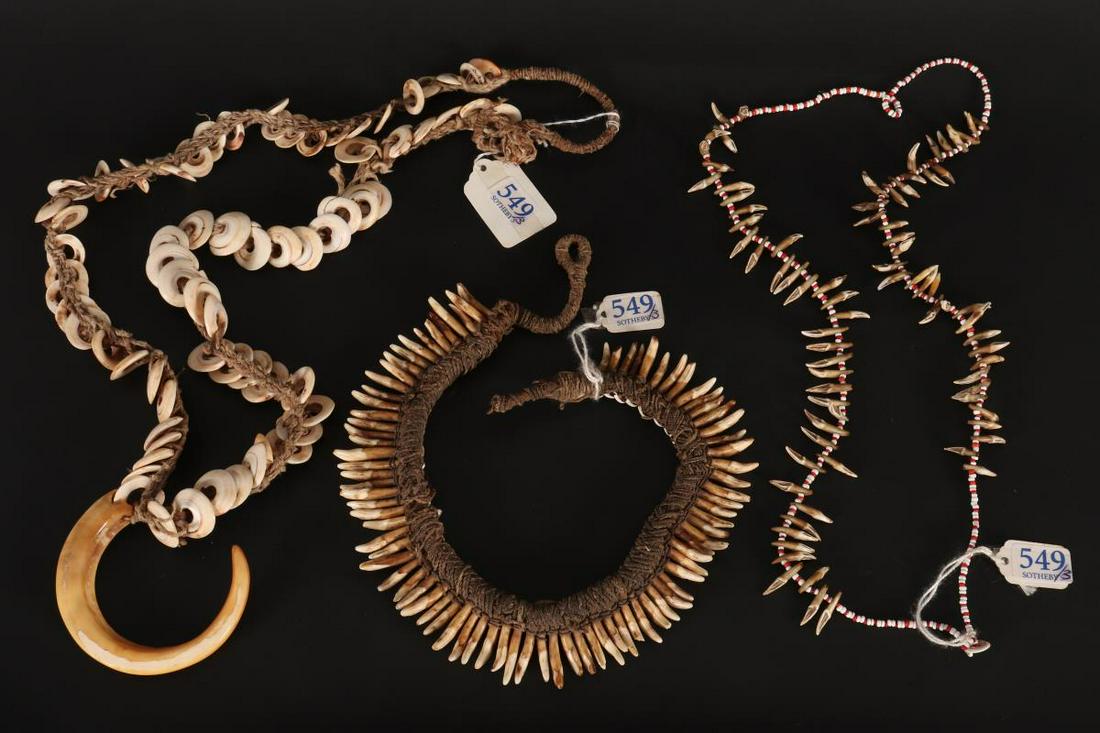 Three Sepik River Necklaces,: in boars tusk, dogs teeth, talons and shells, bounded by natural fiber rope (3) Provenance: Ex-Sotheby's Label, Lot 549