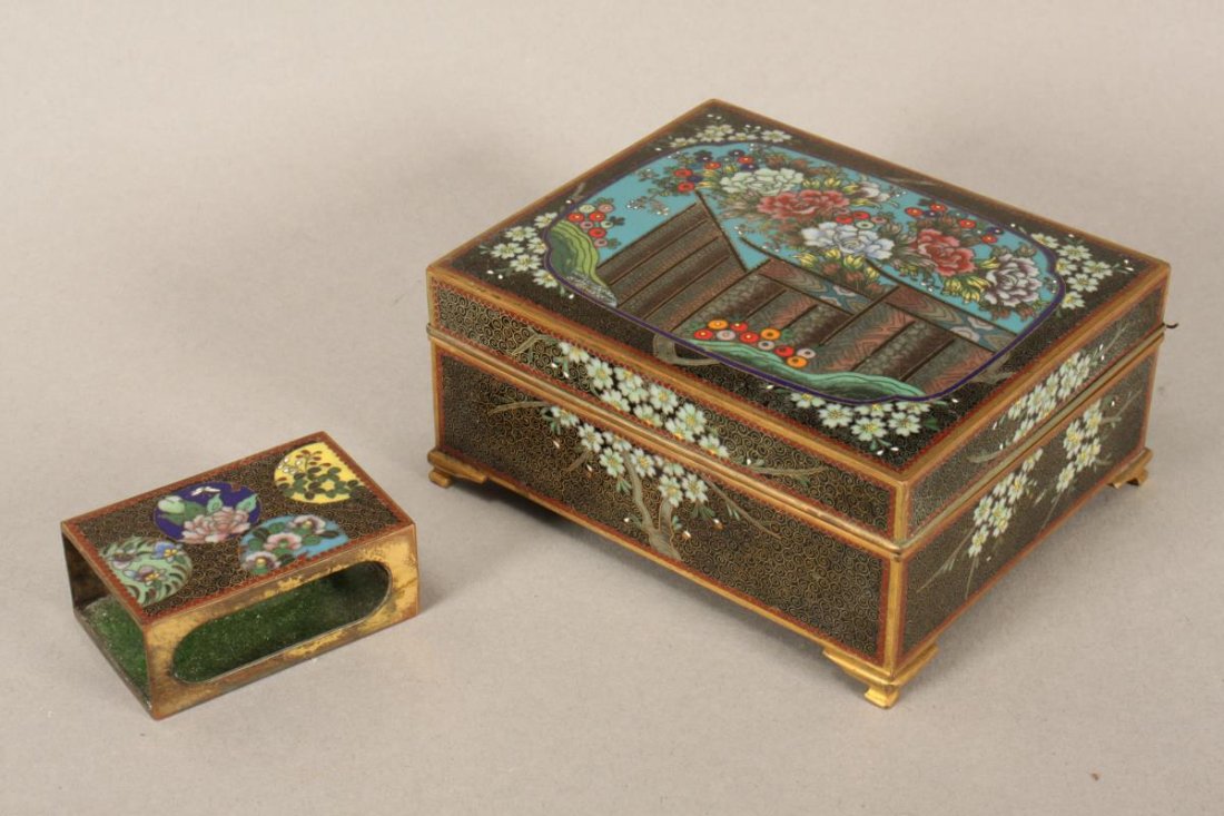 Japanese Cloisonne Box and Match Box,: of rectangular form with a hinged top cover, the exterior decorated with polychrome enamel florals within a shaped reserve, the cover opening to reveal an engraved Mt Fuji scene with sail boats, 5.5cm