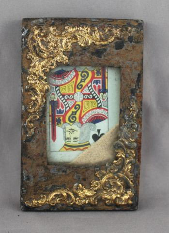 Edwardian Card Trick,: set with a playing card in container with sand