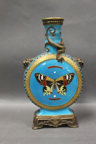Minton Porcelain Moon Flask,: with a shaped cylindrical neck, the pilgrim body decorated with dragons and mask handles, above painted butterfly motif, intones of red, brown, yellow and gilt on a turquoise ground, a/f, h 23cm