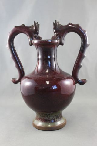 Sang De Beouf Twin Handled Vase,: of baluster form, decorated with dragon handles, h 23cm